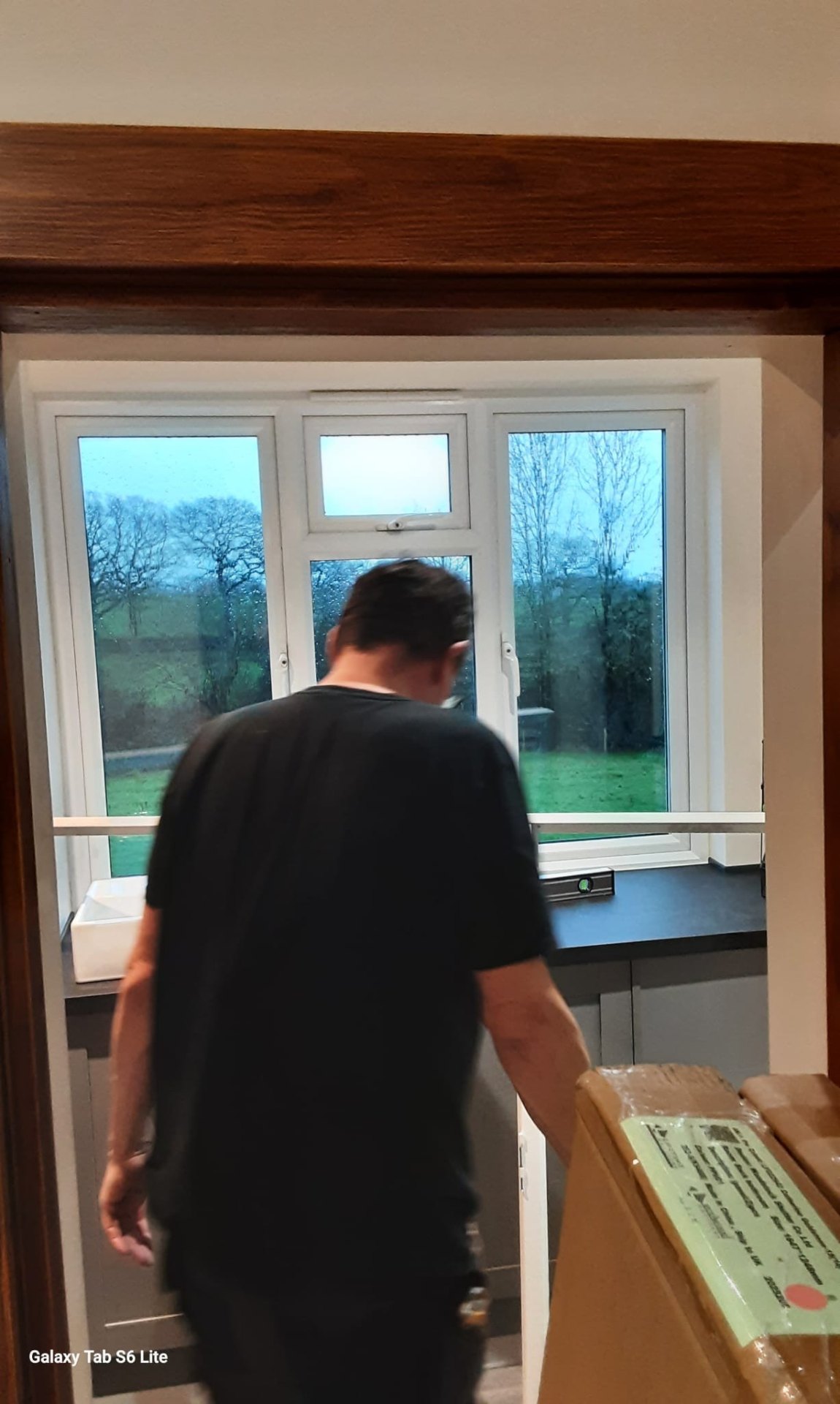 Patterned roman blind on a cottage window